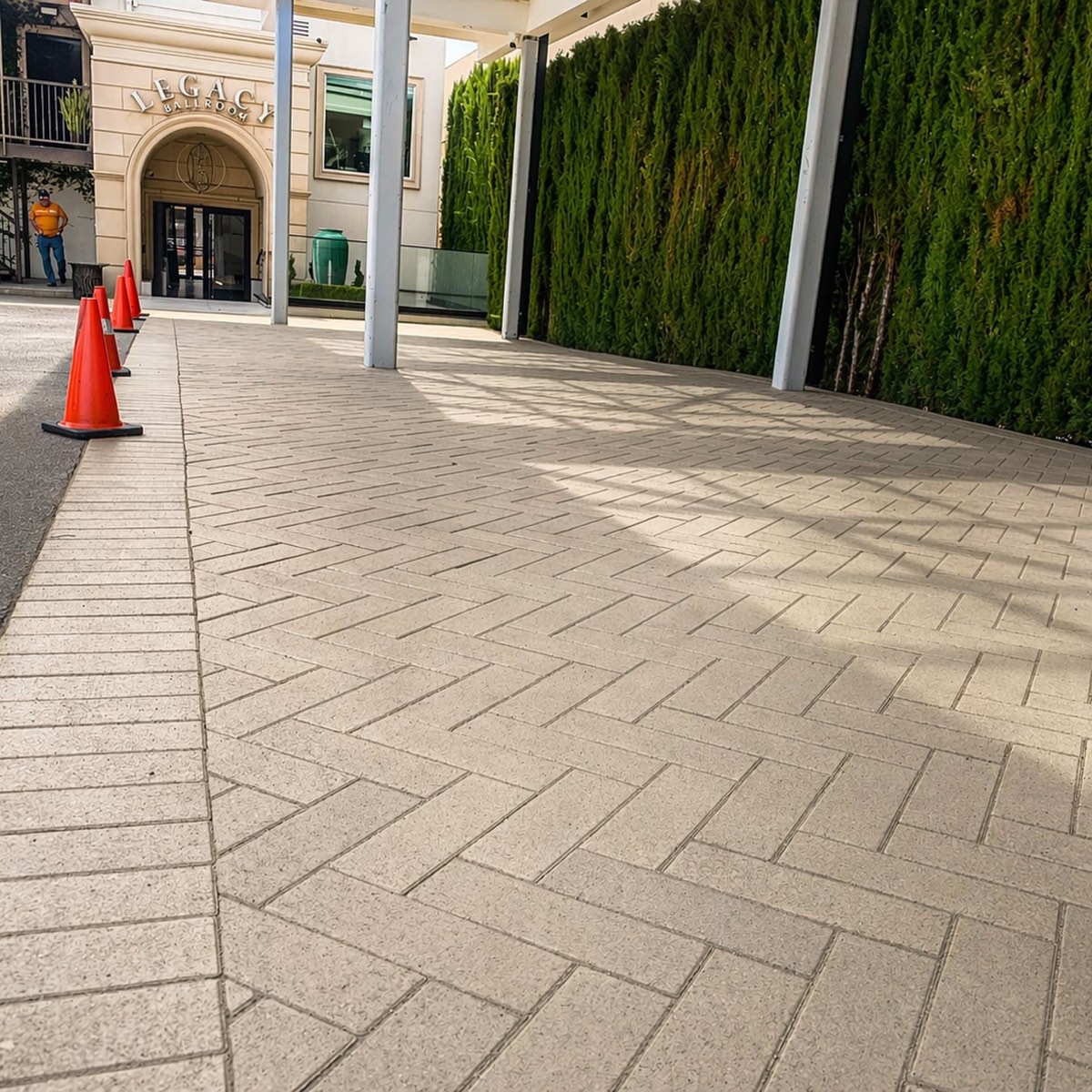 Herringbone paver entrance and walkway at a commercial venue